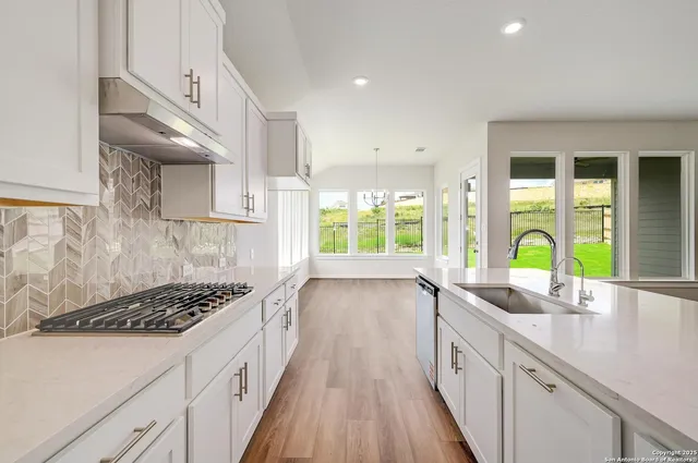 a kitchen with lots of counter top space and a sink