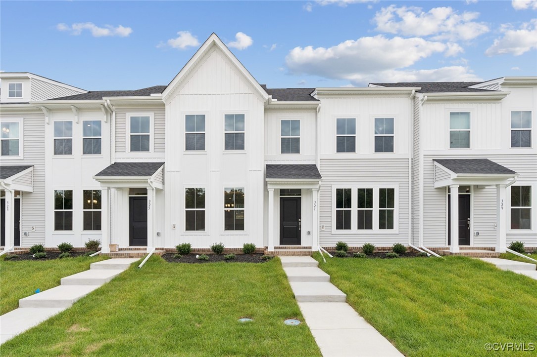 front view of a house with a yard