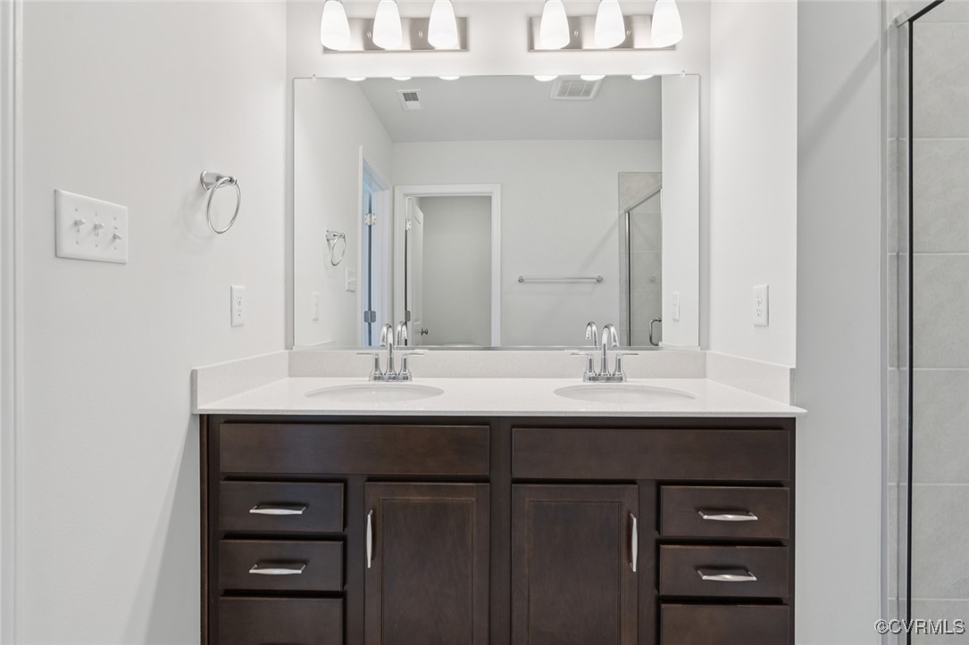 327 Mt Mccauley Way Aylett, VA 23009 - Photo 13 of 50 a bathroom with a sink and a mirror