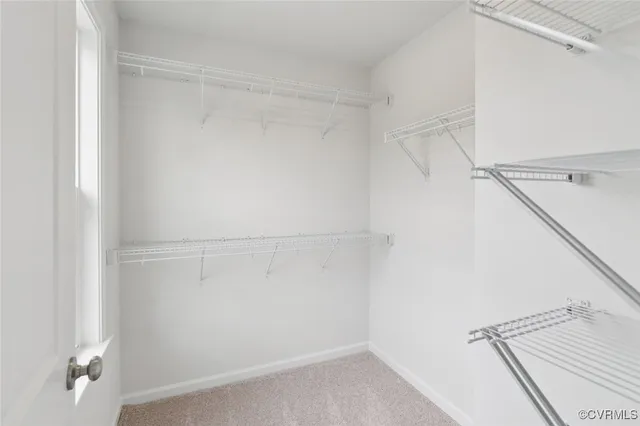 a bathroom with a shower sink vanity and mirror