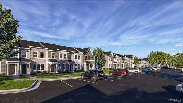 a view of a street with a house in the background