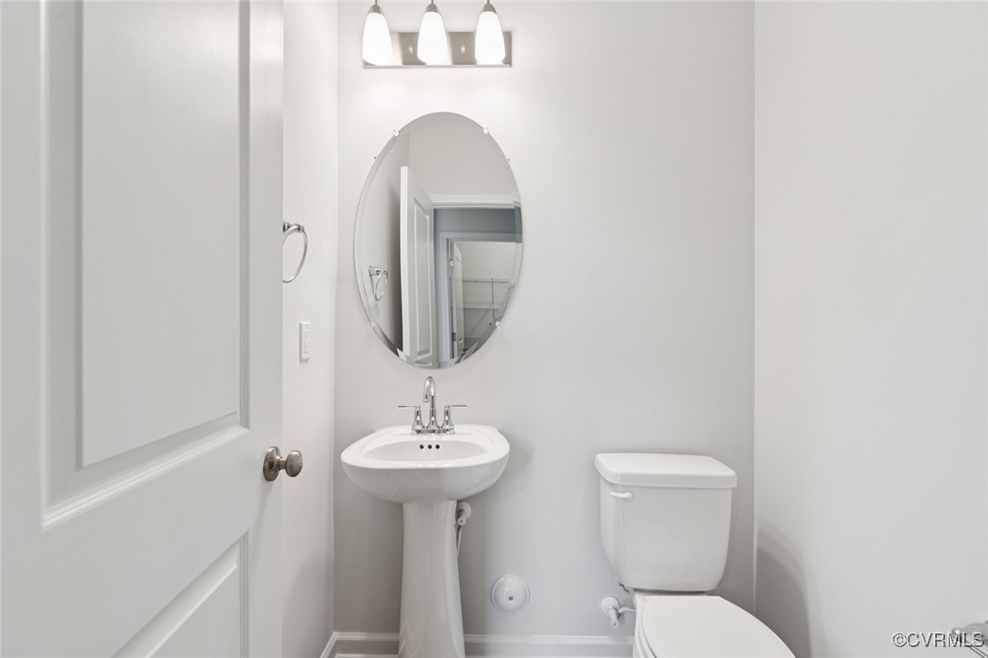 327 Mt Mccauley Way Aylett, VA 23009 - Photo 10 of 50 a bathroom with a toilet sink and mirror