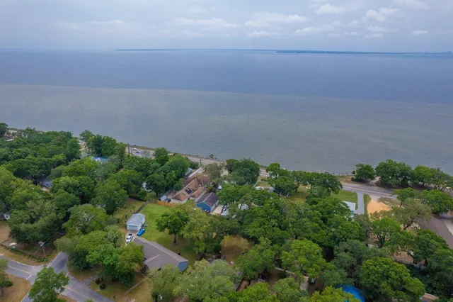 an aerial view of multiple house with outdoor space
