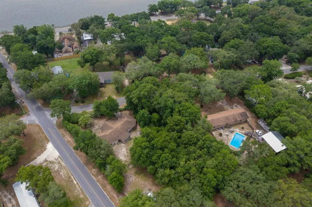 a view of a swimming pool and a yard