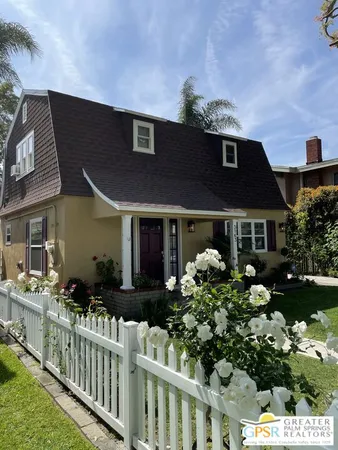 a front view of house with yard and outdoor seating