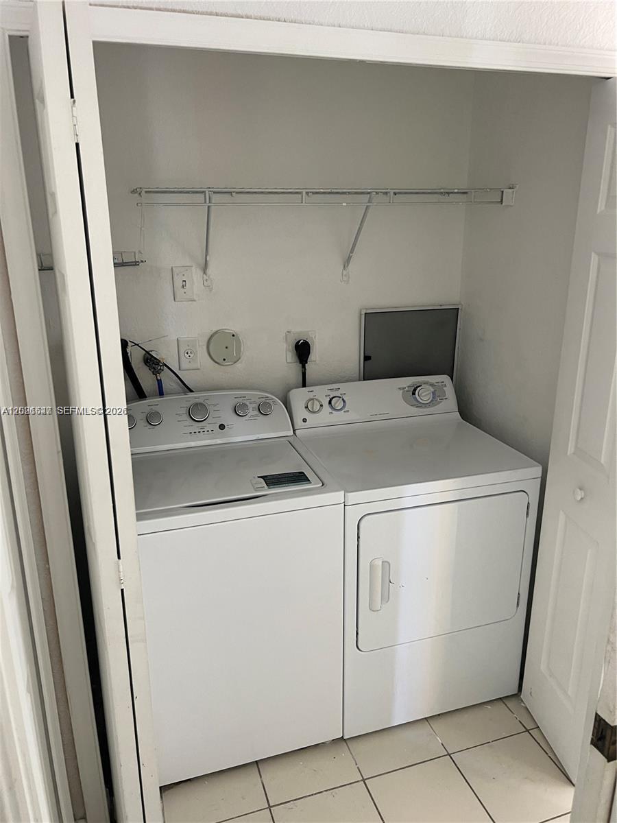 2910 Southeast 15th Road, Unit 55 Homestead, FL 33035 - Photo 7 of 13 a utility room with dryer and washer