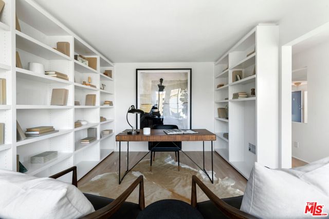 a view of a livingroom with furniture and a window