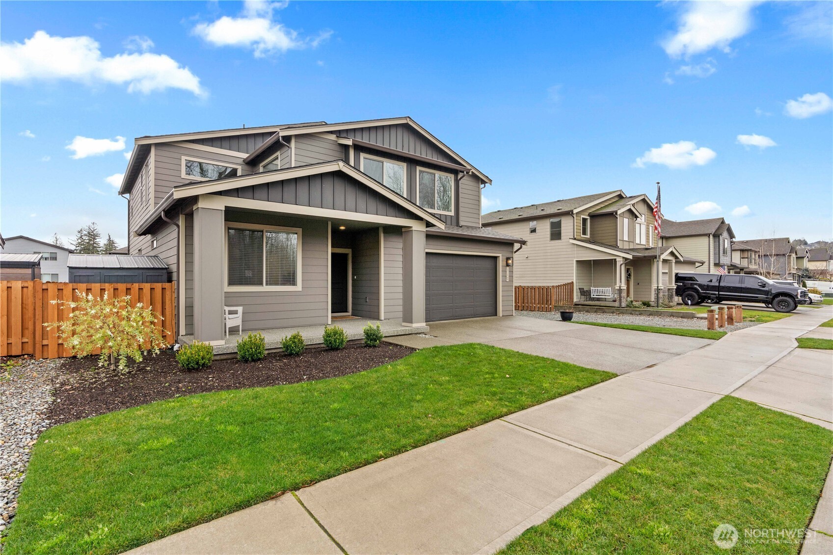 342 South Spruce Street Buckley, WA 98321 - Photo 2 of 34 a front view of a house with a garden and plants