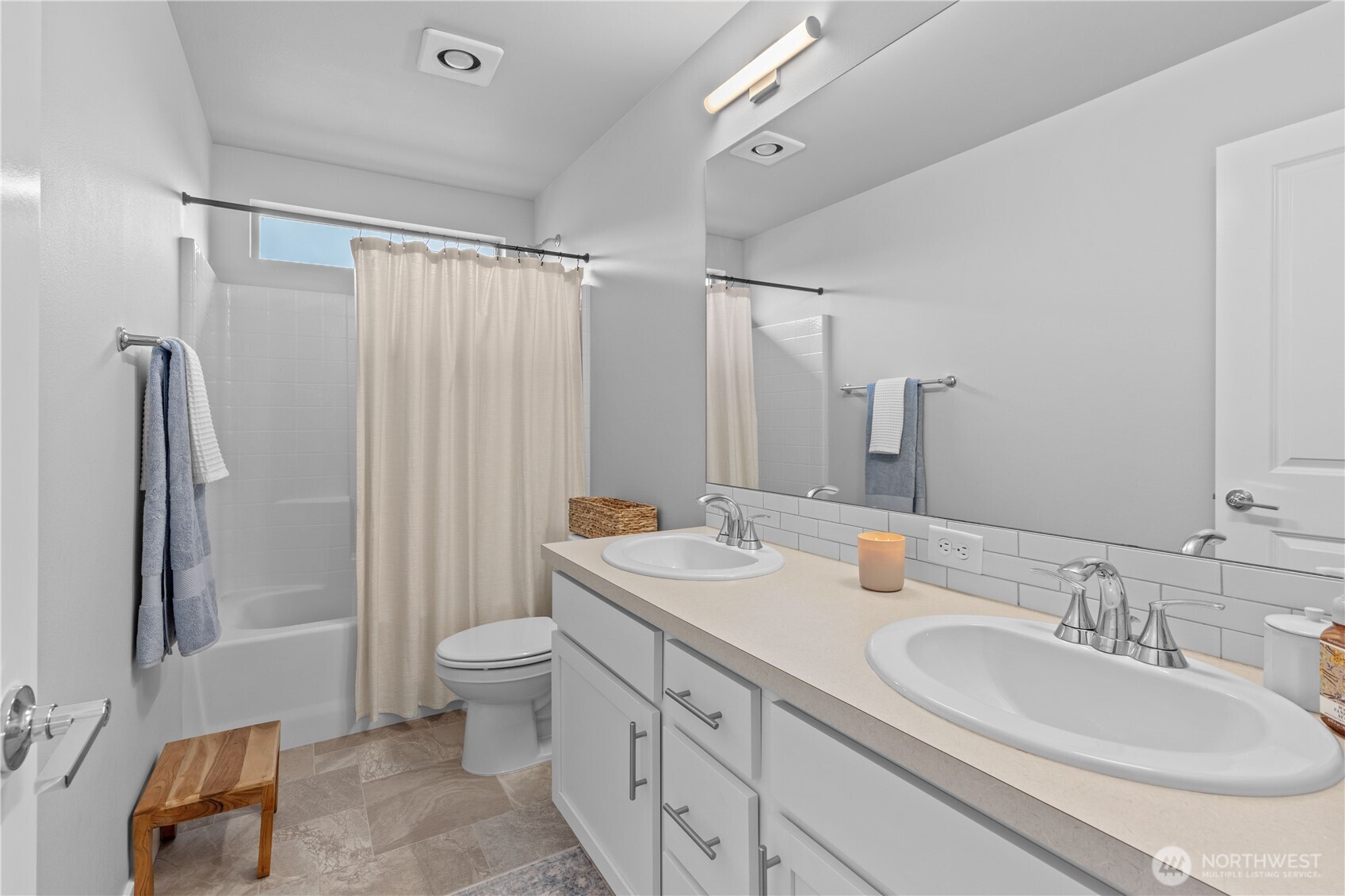 342 South Spruce Street Buckley, WA 98321 - Photo 23 of 34 a bathroom with double vanity sink a mirror and a shower