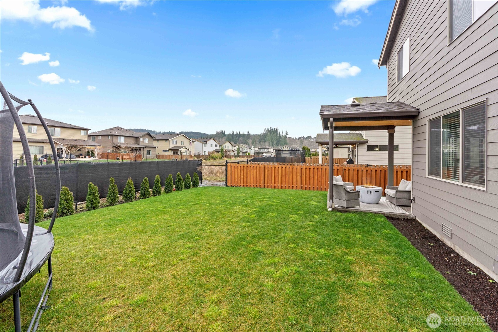 342 South Spruce Street Buckley, WA 98321 - Photo 31 of 34 a view of a house with backyard porch and garden