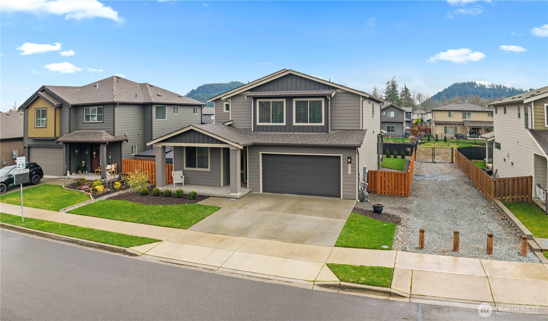 342 South Spruce Street Buckley, WA 98321 - Photo 33 of 34 a front view of a house with a yard and garage
