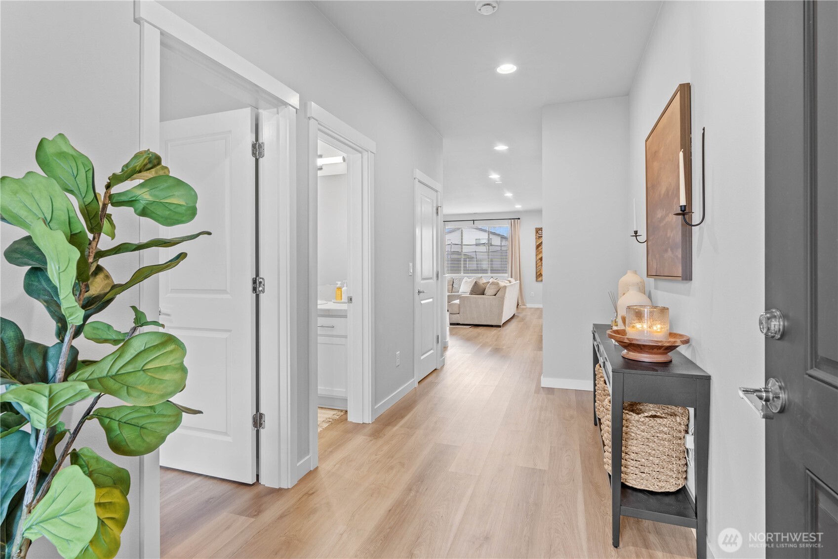 342 South Spruce Street Buckley, WA 98321 - Photo 4 of 34 a hallway with painting and wooden floor
