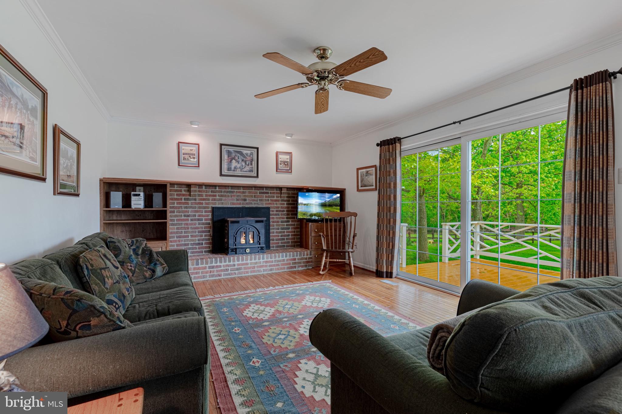 21709 St Louis Road Middleburg, VA 20117 - Photo 14 of 47 View of family room, with fireplace, from kitchen.