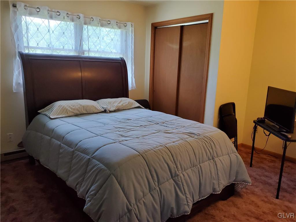 3526 High Hill Road Effort, PA 18330 - Photo 17 of 32 a bedroom with a bed and wooden floor