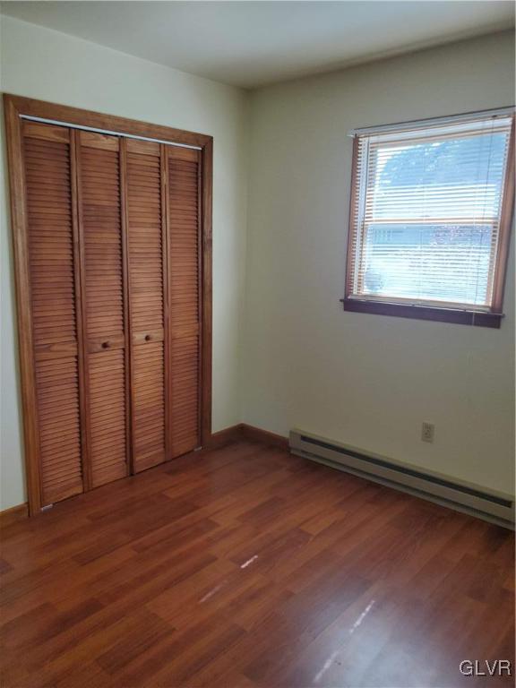 3526 High Hill Road Effort, PA 18330 - Photo 18 of 32 an empty room with wooden floor and a window