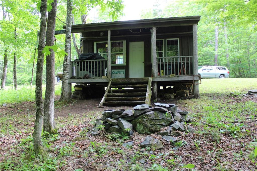 1 York Mill Athens, ME 04912 - Photo 2 of 23 Great covered porch with fire pit in...