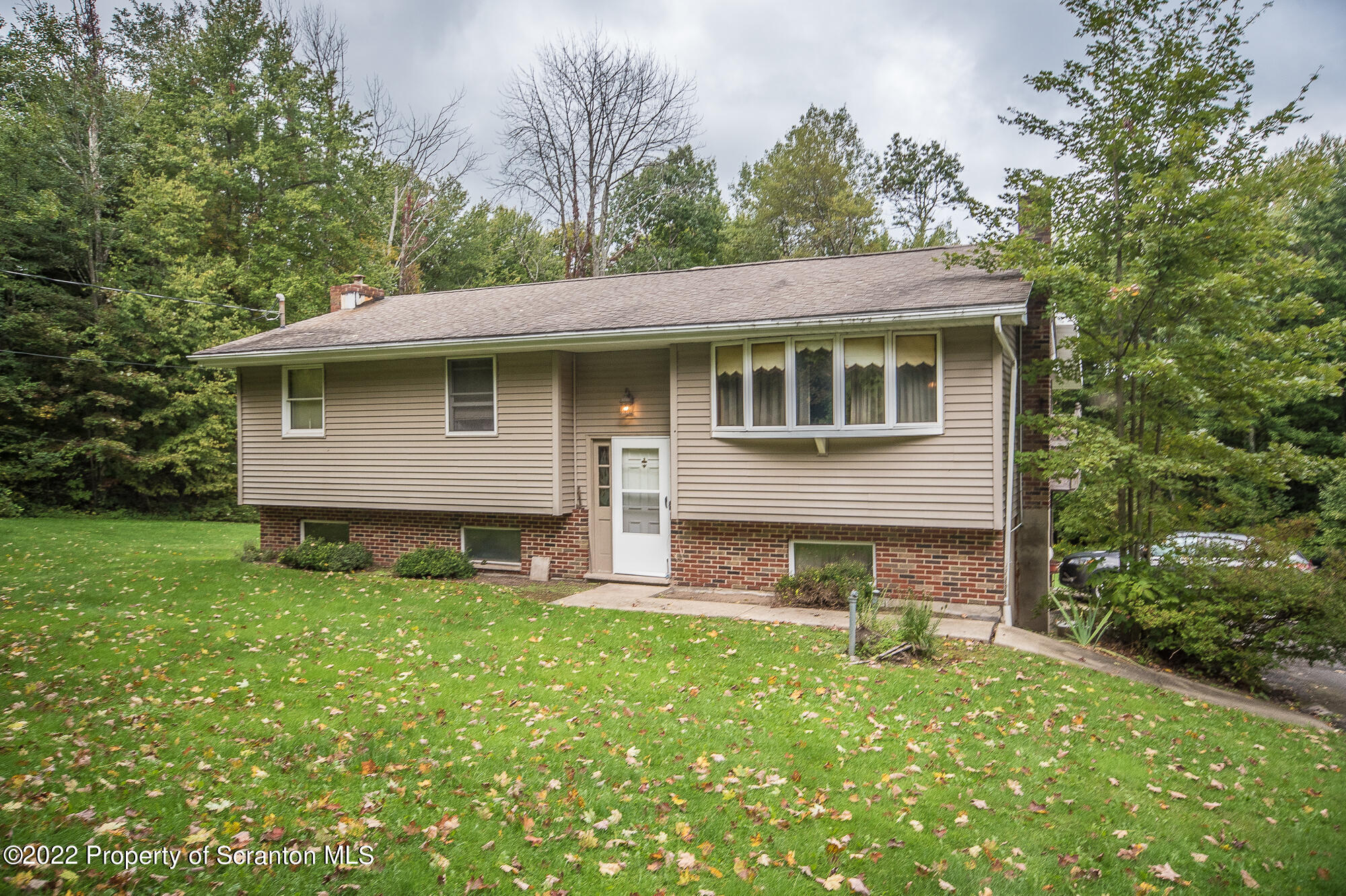 1971 Becks Crossing Road Moscow, PA 18444 - Photo 1 of 31 a backyard of a house with table and chairs
