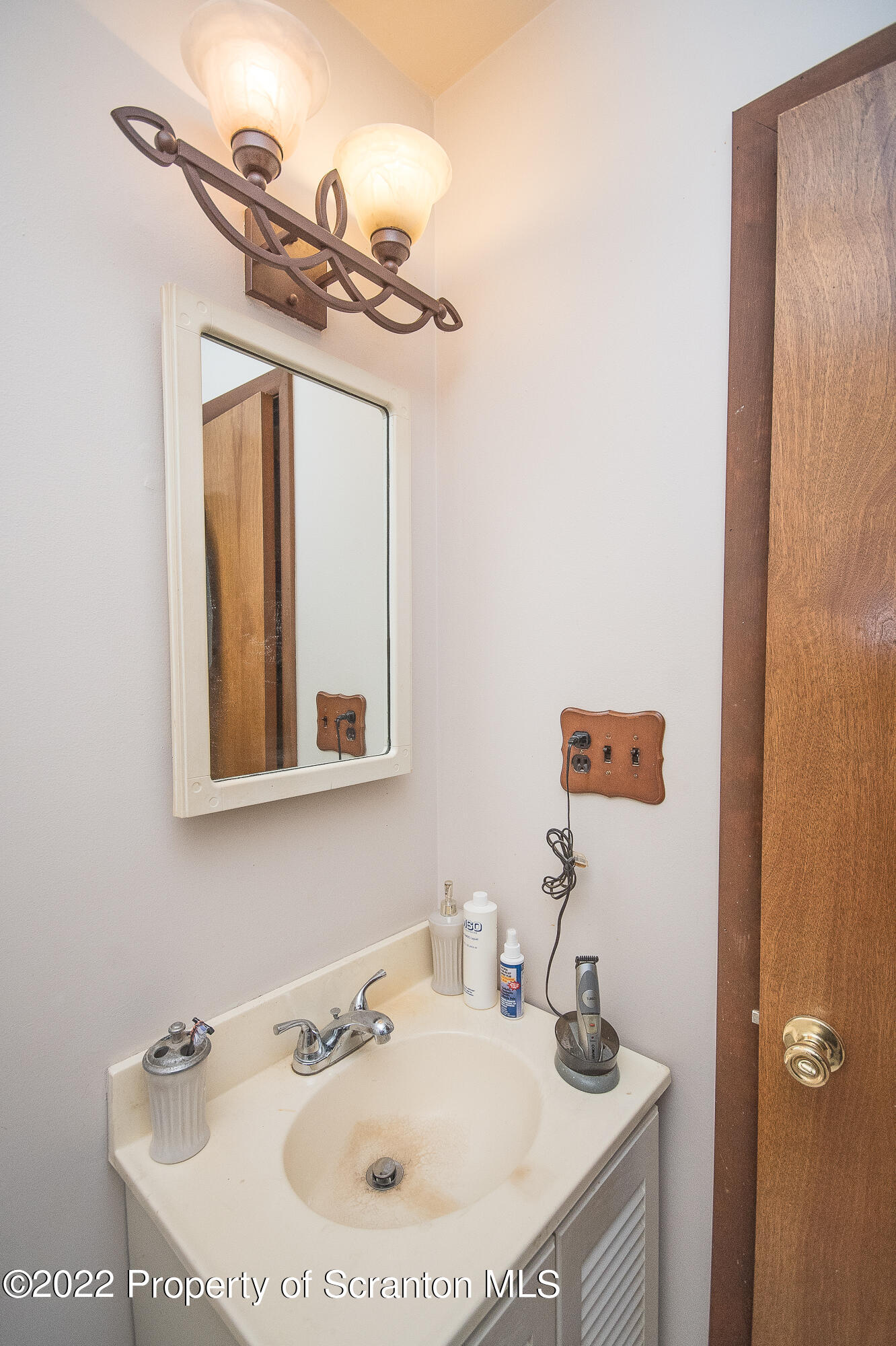 1971 Becks Crossing Road Moscow, PA 18444 - Photo 11 of 31 a bathroom with a sink and a mirror