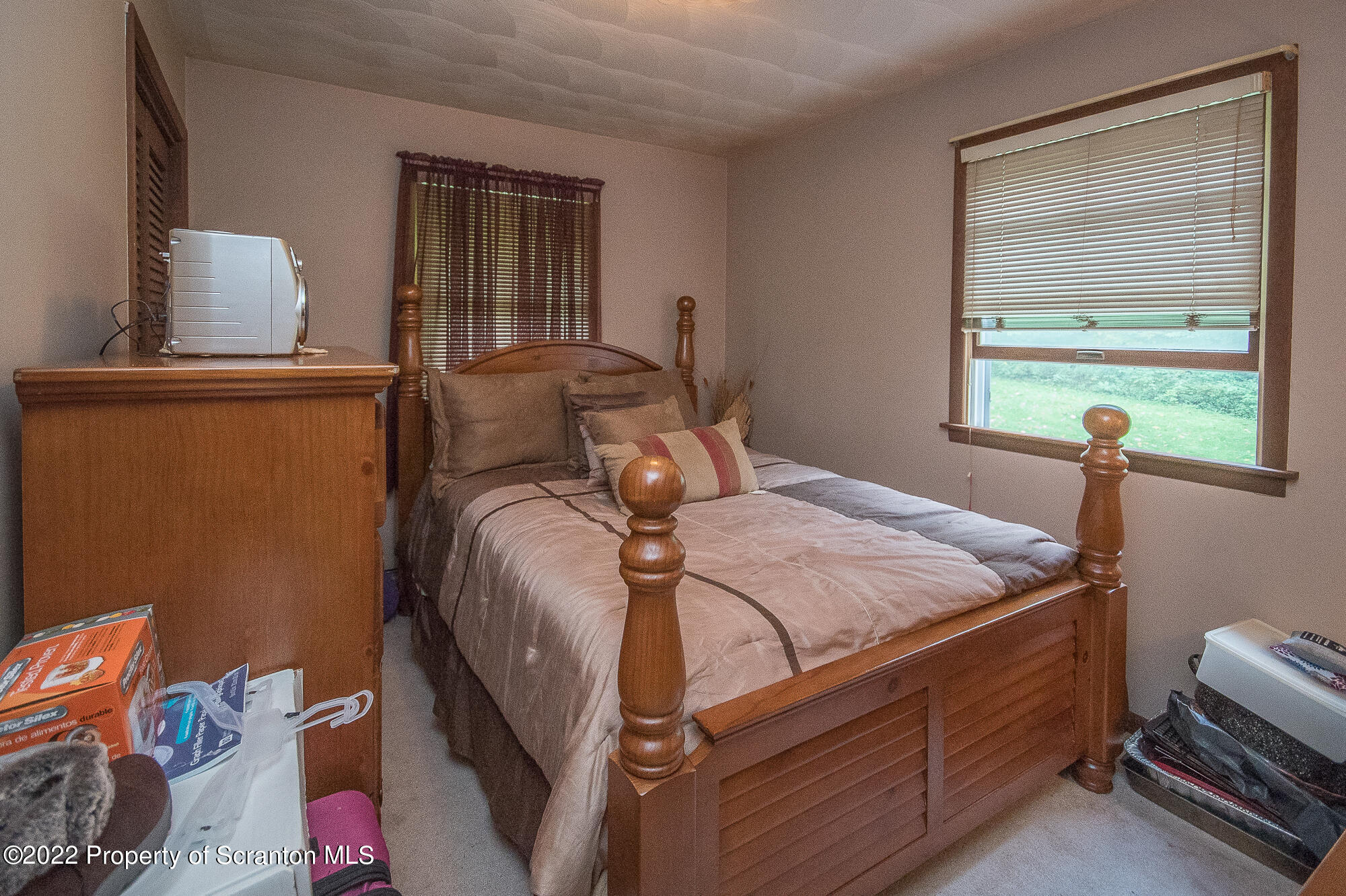 1971 Becks Crossing Road Moscow, PA 18444 - Photo 12 of 31 a bedroom with a bed and wooden floor