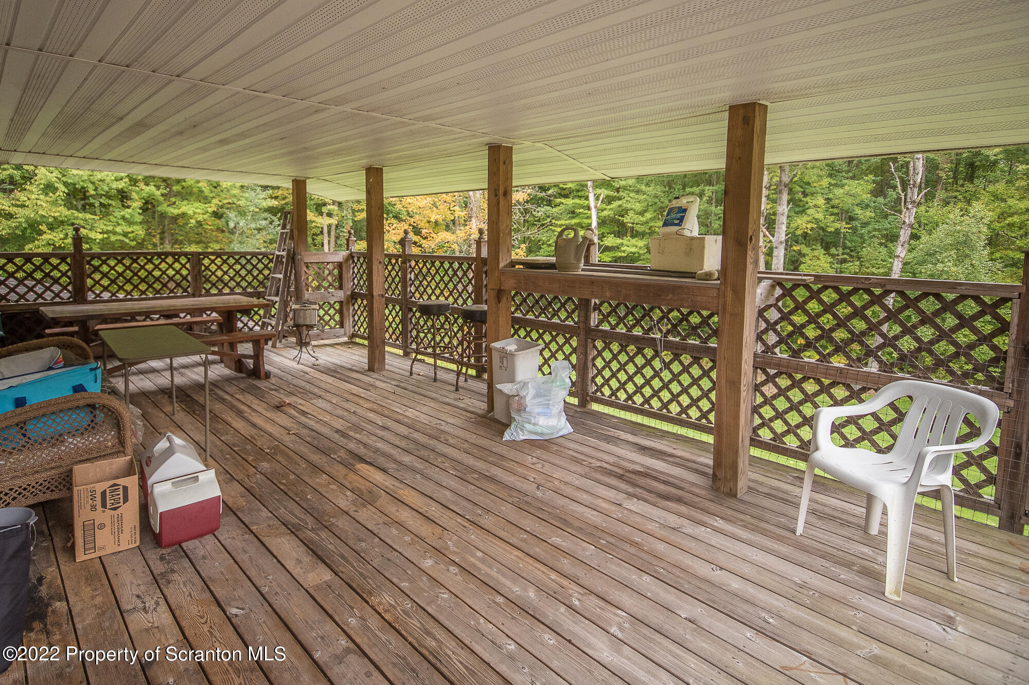 1971 Becks Crossing Road Moscow, PA 18444 - Photo 22 of 31 a view of a deck with wooden floor and outdoor seating
