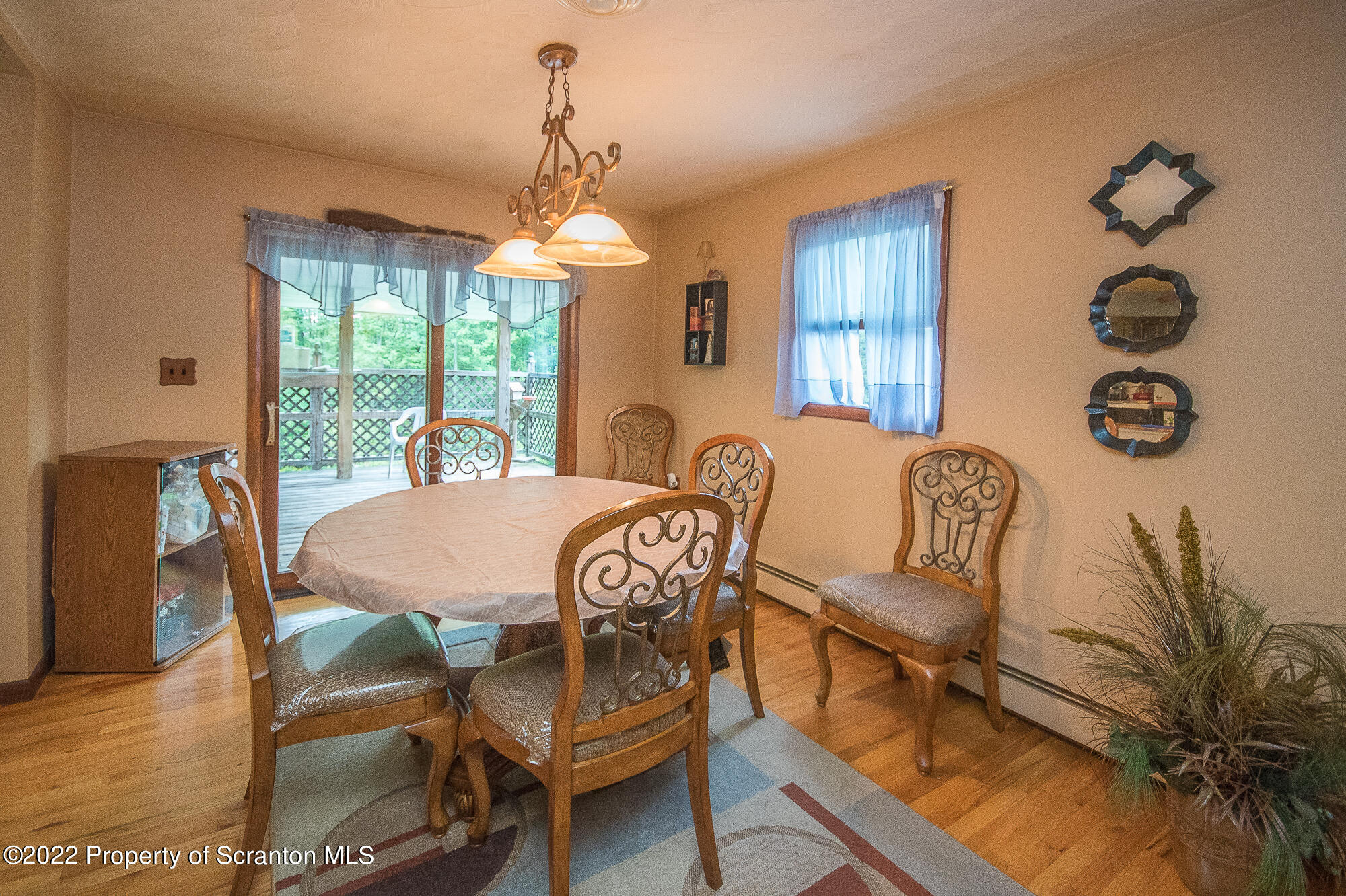 1971 Becks Crossing Road Moscow, PA 18444 - Photo 4 of 31 a view of a dining room with furniture wooden floor and chandelier