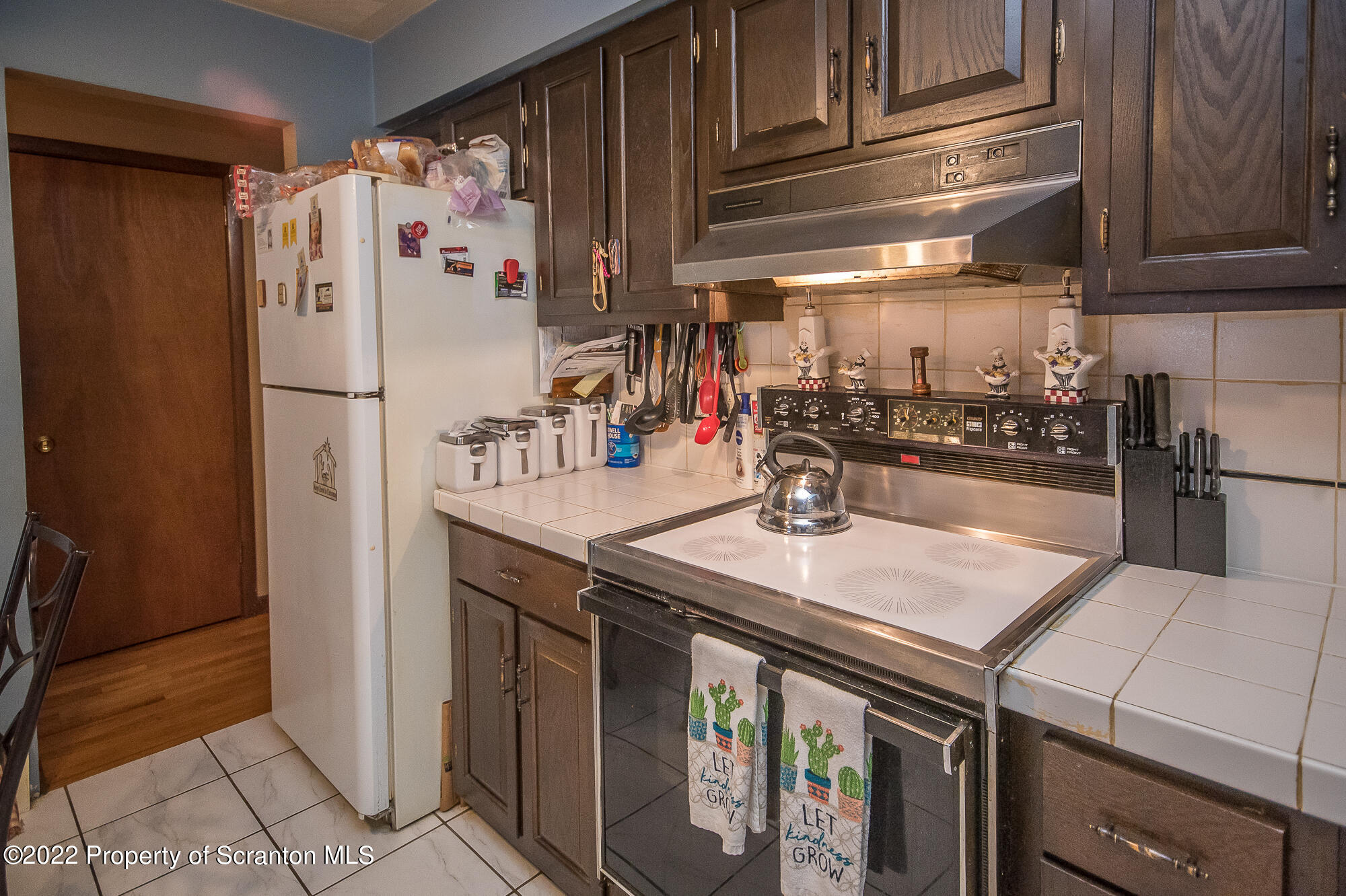 1971 Becks Crossing Road Moscow, PA 18444 - Photo 6 of 31 a kitchen with stainless steel appliances granite countertop a refrigerator and a stove