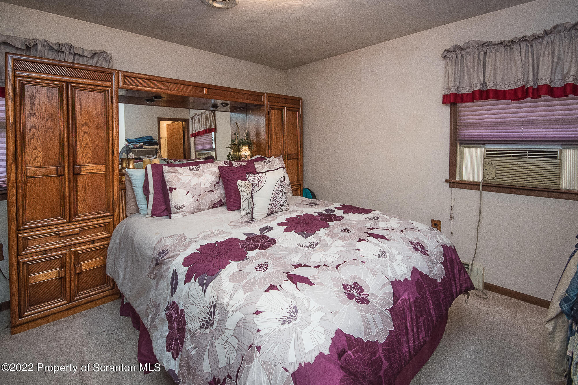 1971 Becks Crossing Road Moscow, PA 18444 - Photo 8 of 31 a bedroom with a large bed and a dresser