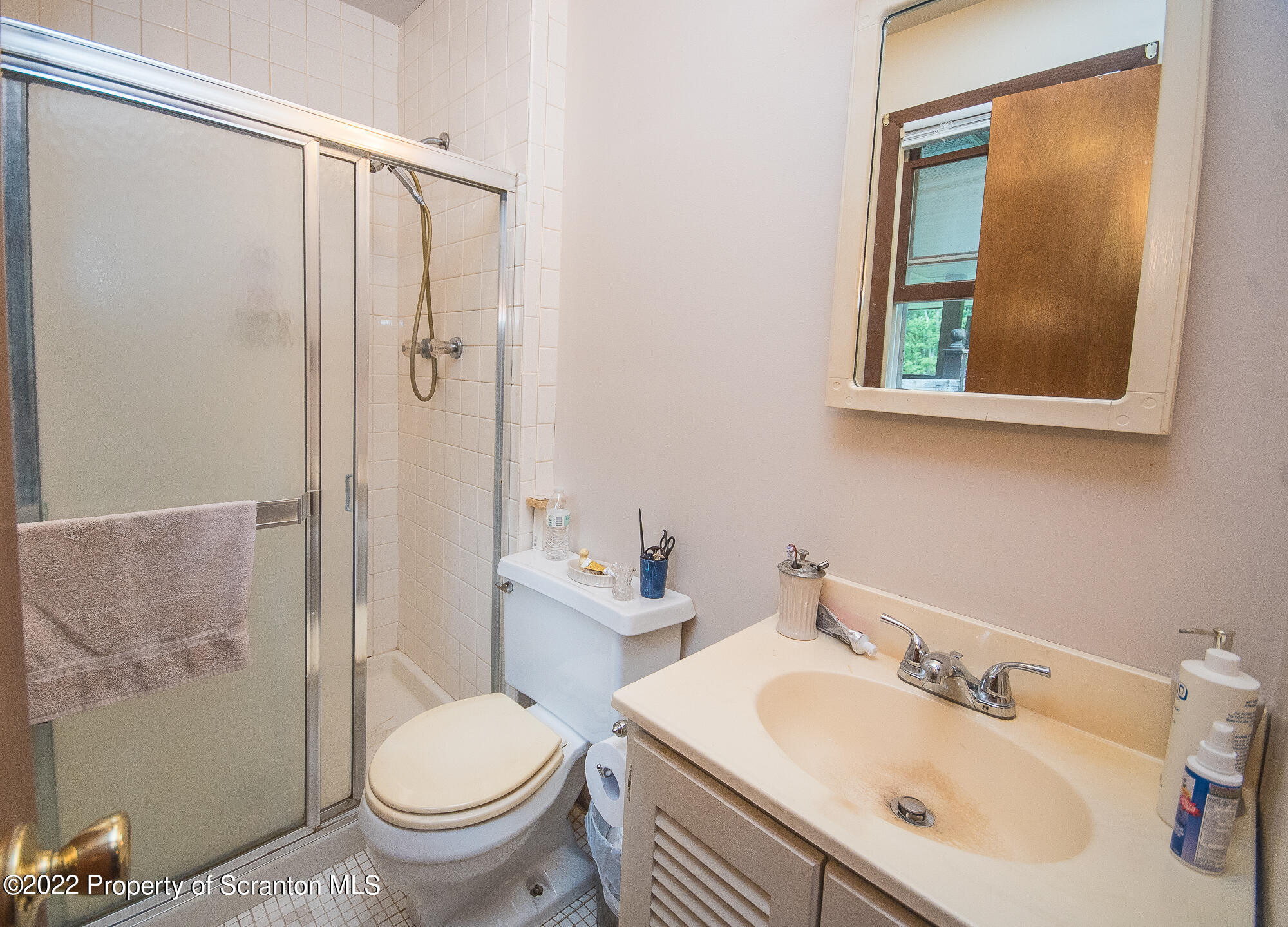 1971 Becks Crossing Road Moscow, PA 18444 - Photo 10 of 31 a bathroom with a sink toilet and shower