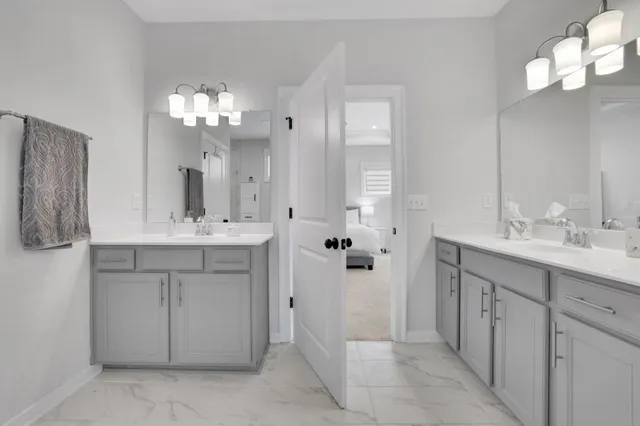 a bathroom with a sink vanity and a mirror