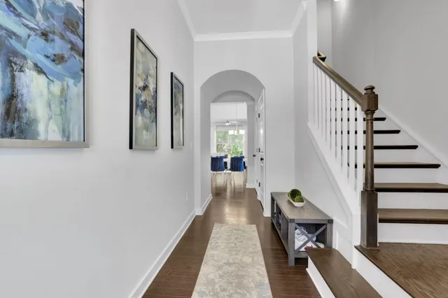 a view of gallery with wooden floor