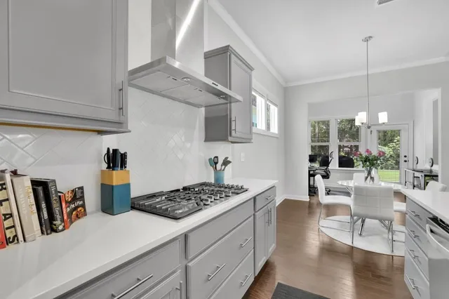a kitchen with a table and chairs in it