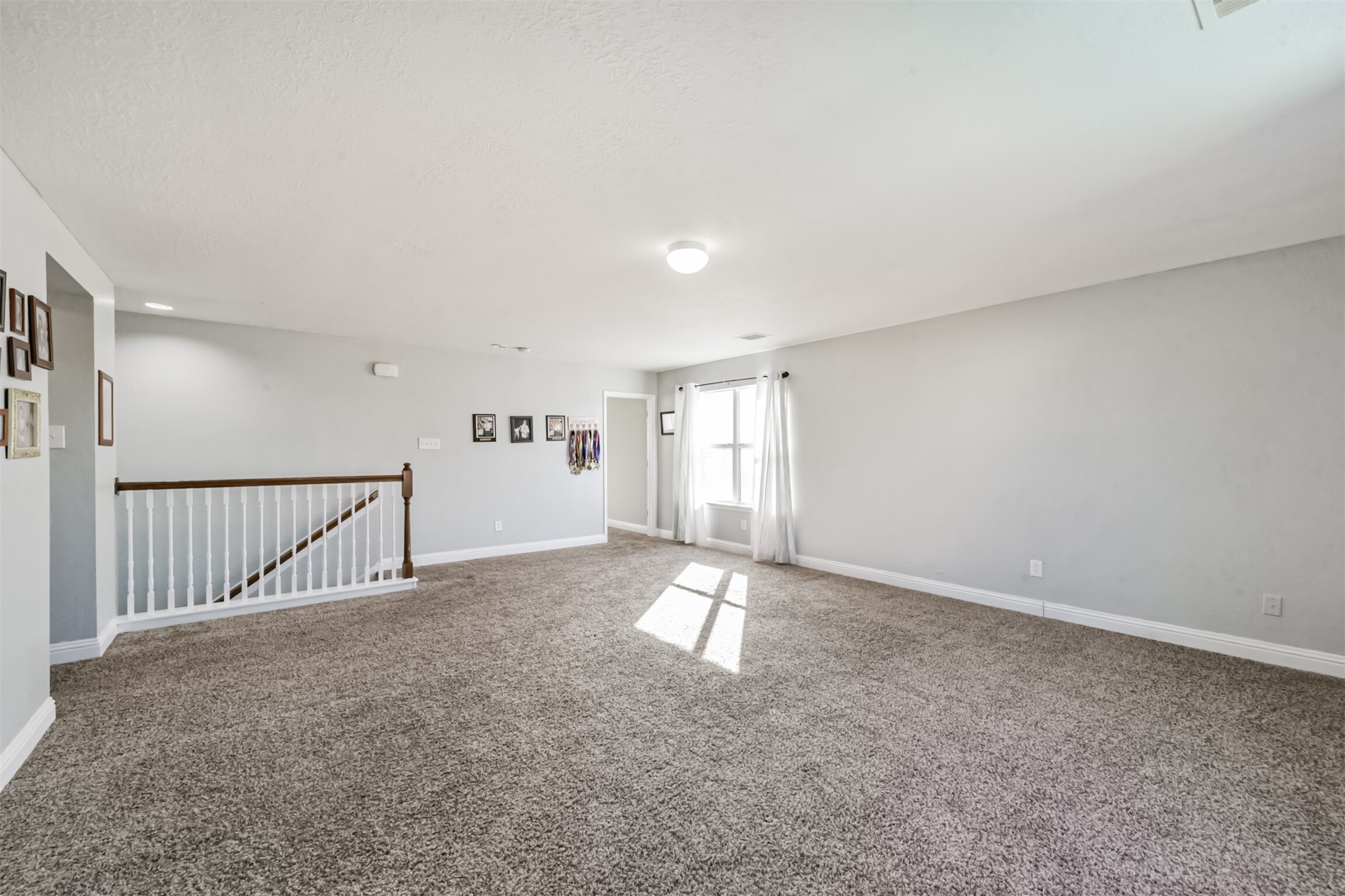 7015 Falling Cherry Place Houston, TX 77049 - Photo 27 of 42 a view of an empty room