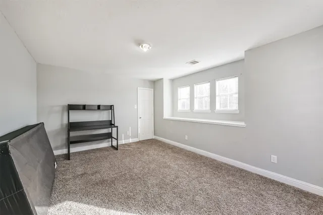 a view of room with window and ceiling fan