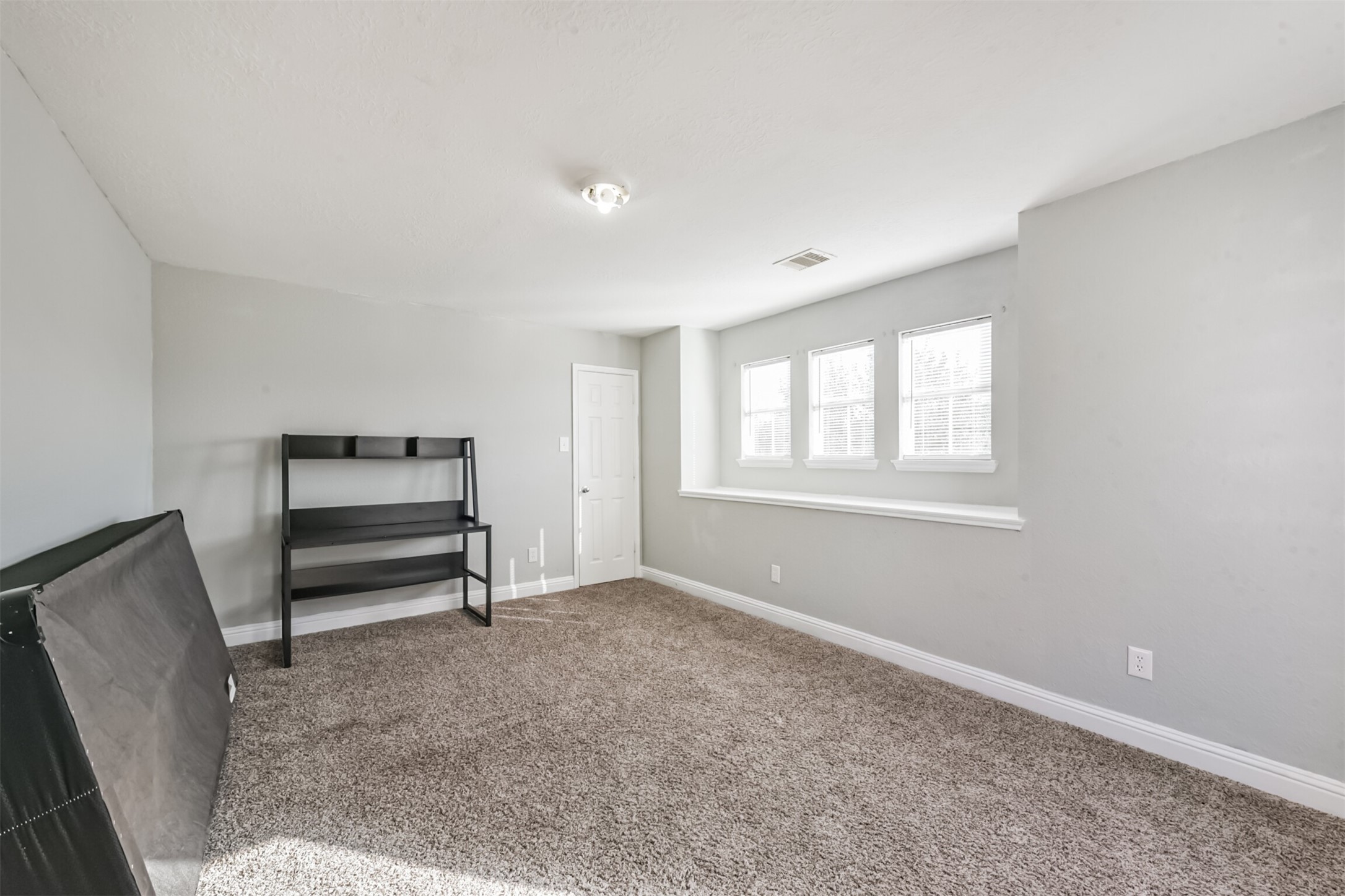 7015 Falling Cherry Place Houston, TX 77049 - Photo 28 of 42 a view of room with a window