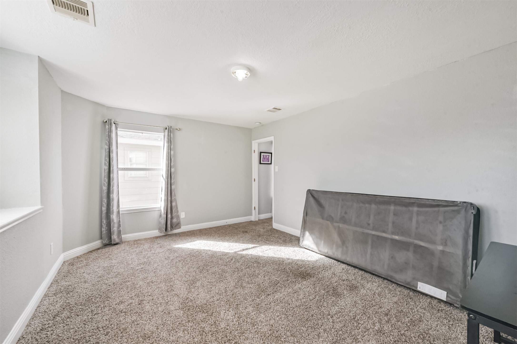 7015 Falling Cherry Place Houston, TX 77049 - Photo 29 of 42 a view of room with window and ceiling fan