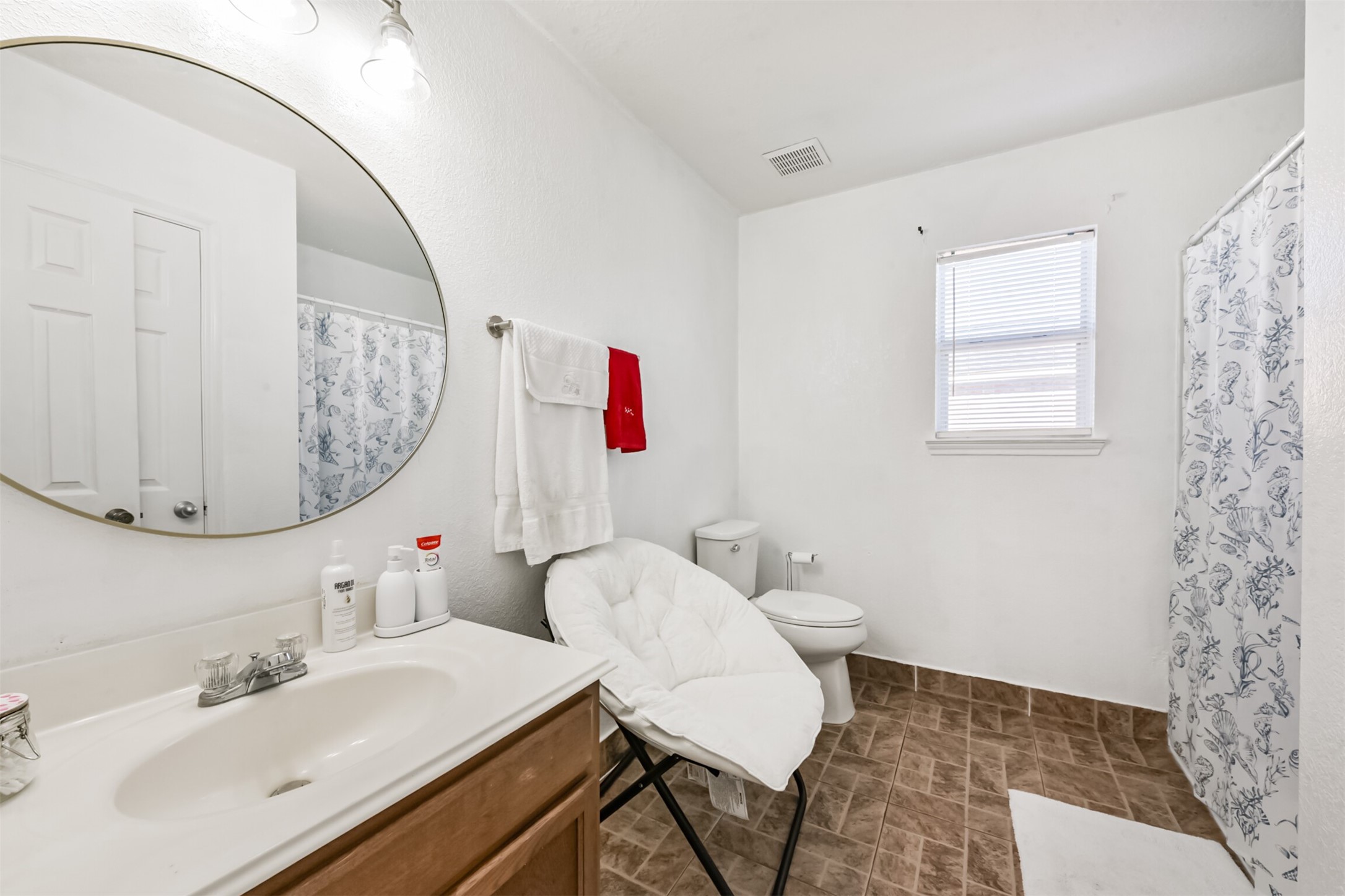 7015 Falling Cherry Place Houston, TX 77049 - Photo 34 of 42 a bathroom with a sink vanity mirror and toilet