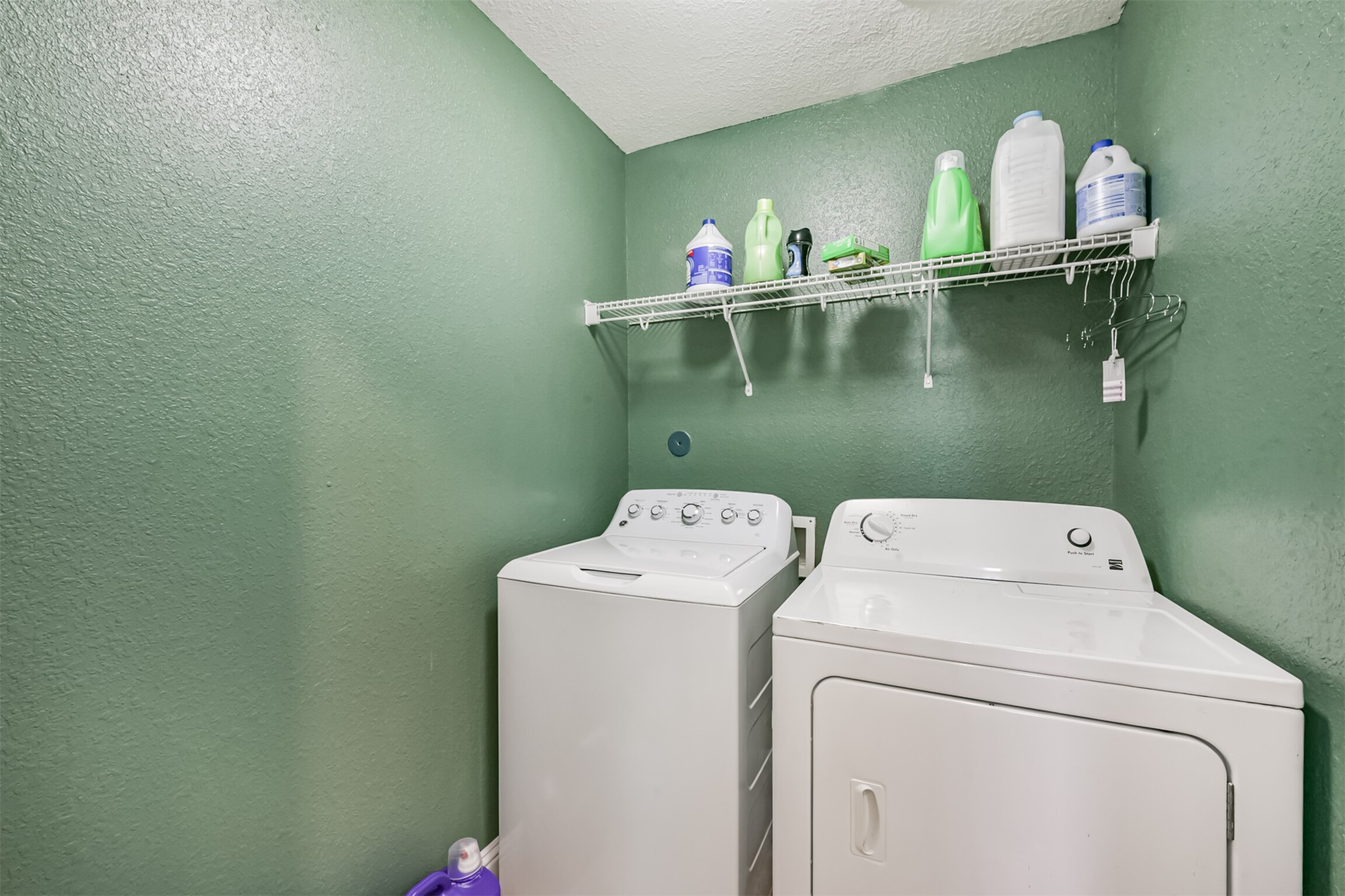 7015 Falling Cherry Place Houston, TX 77049 - Photo 35 of 42 a view of storage and utility room with washer and dryer