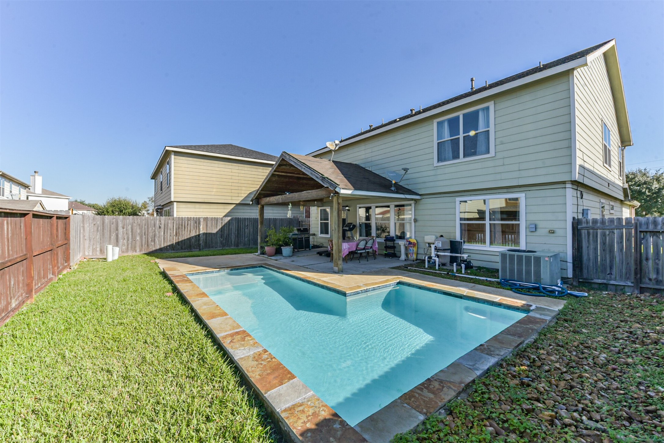 7015 Falling Cherry Place Houston, TX 77049 - Photo 39 of 42 a view of a house with swimming pool and sitting area