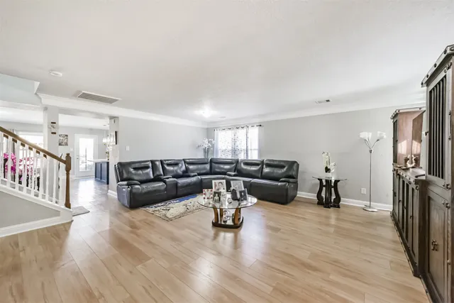 a living room with fireplace furniture and a flat screen tv