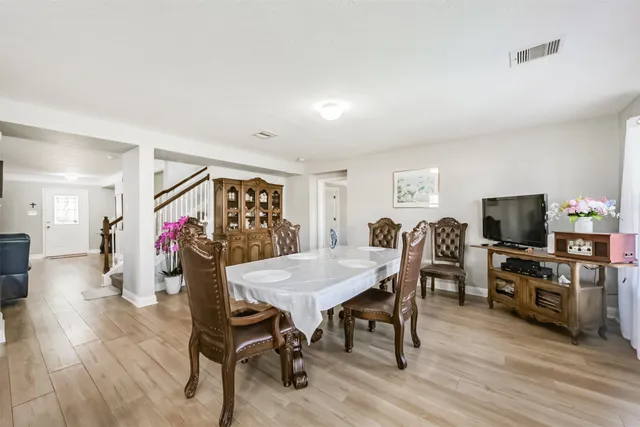 a view of a livingroom with furniture and a flat screen tv