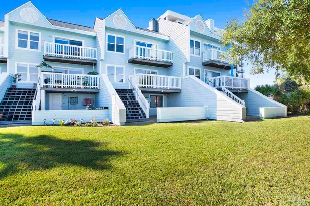 a house view with swimming pool in front of it