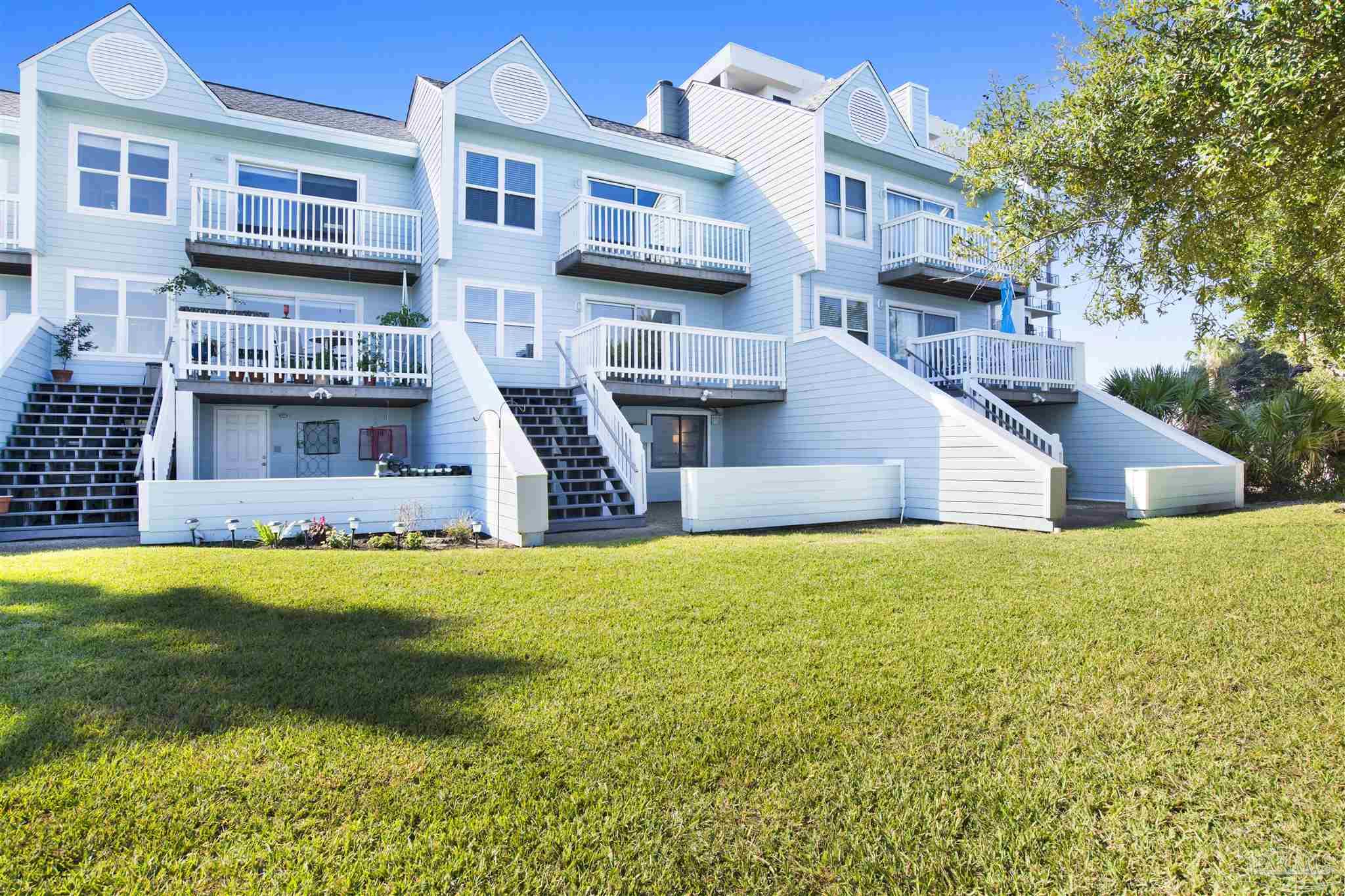 16784 Perdido Key Drive, Unit 9 Pensacola, FL 32507 - Photo 2 of 48 a house view with swimming pool in front of it
