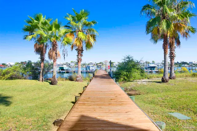 a view of a lake with houses in the background