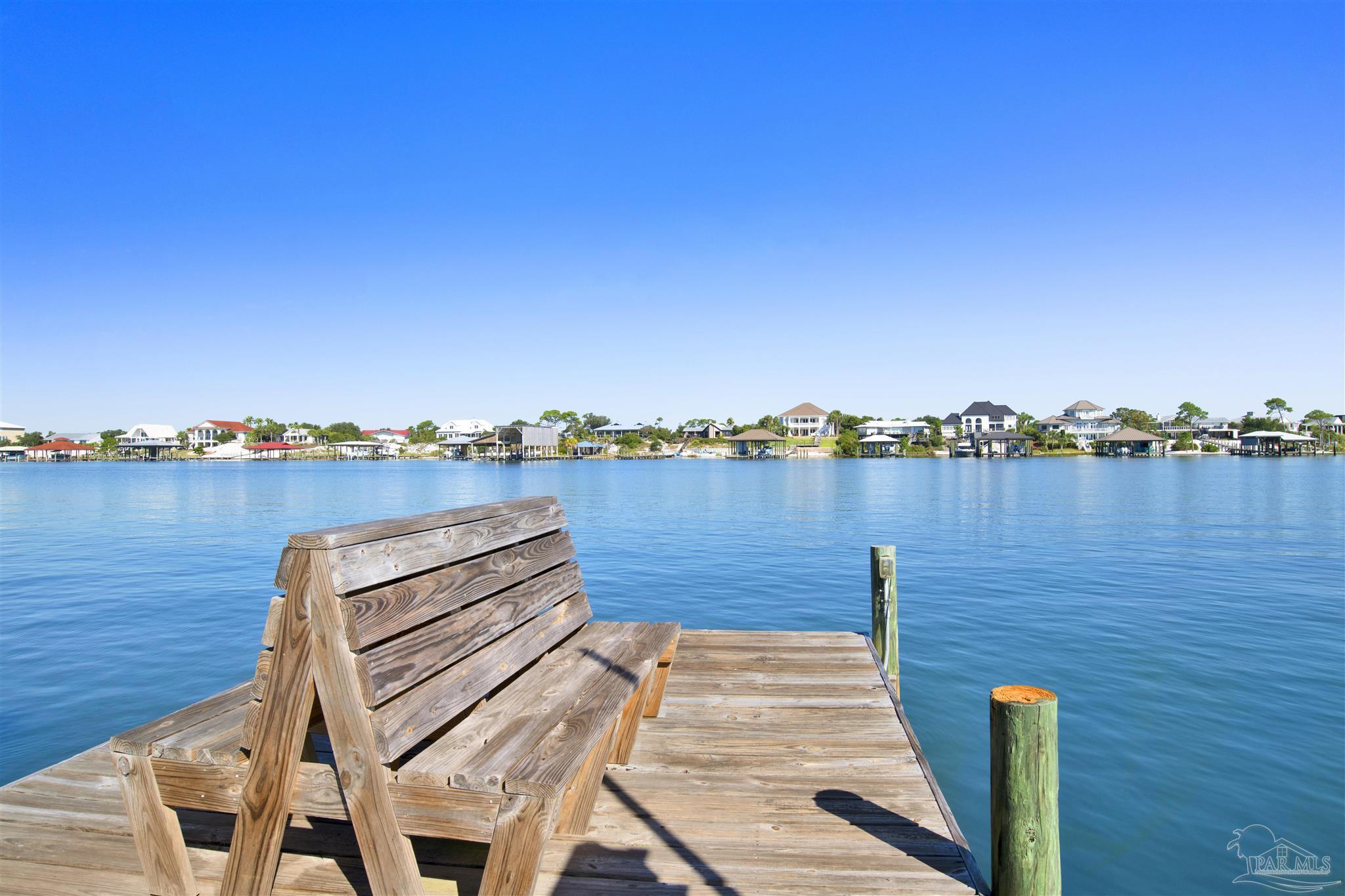 16784 Perdido Key Drive, Unit 9 Pensacola, FL 32507 - Photo 29 of 48 a view of a lake with houses in the background