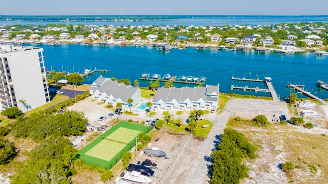 an aerial view of a house with a swimming pool yard and outdoor seating