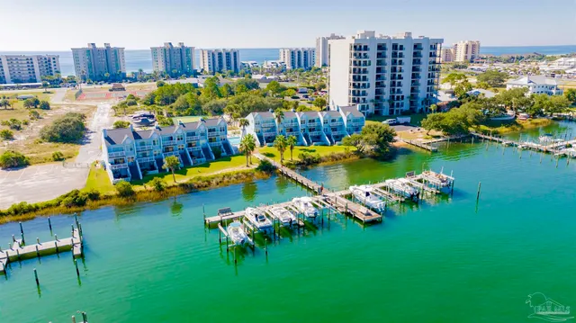 an aerial view of a house with a swimming pool yard and outdoor seating