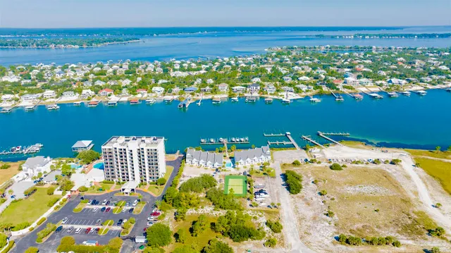 a view of kitchen with a sink and refrigerator