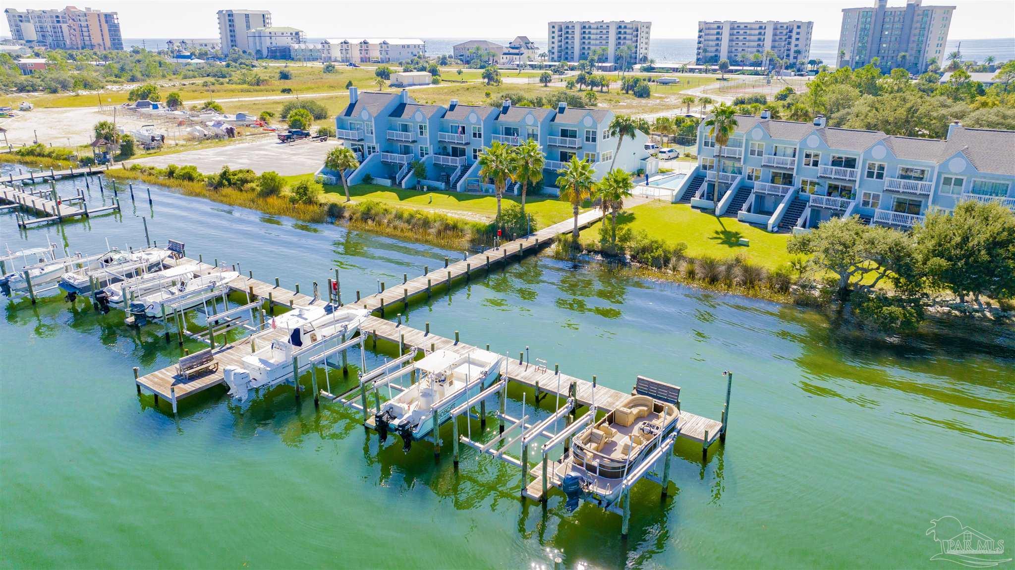 16784 Perdido Key Drive, Unit 9 Pensacola, FL 32507 - Photo 45 of 48 an aerial view of a house with a swimming pool yard and outdoor seating