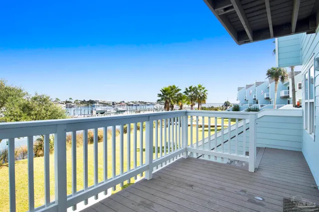 a view of a balcony with wooden floor