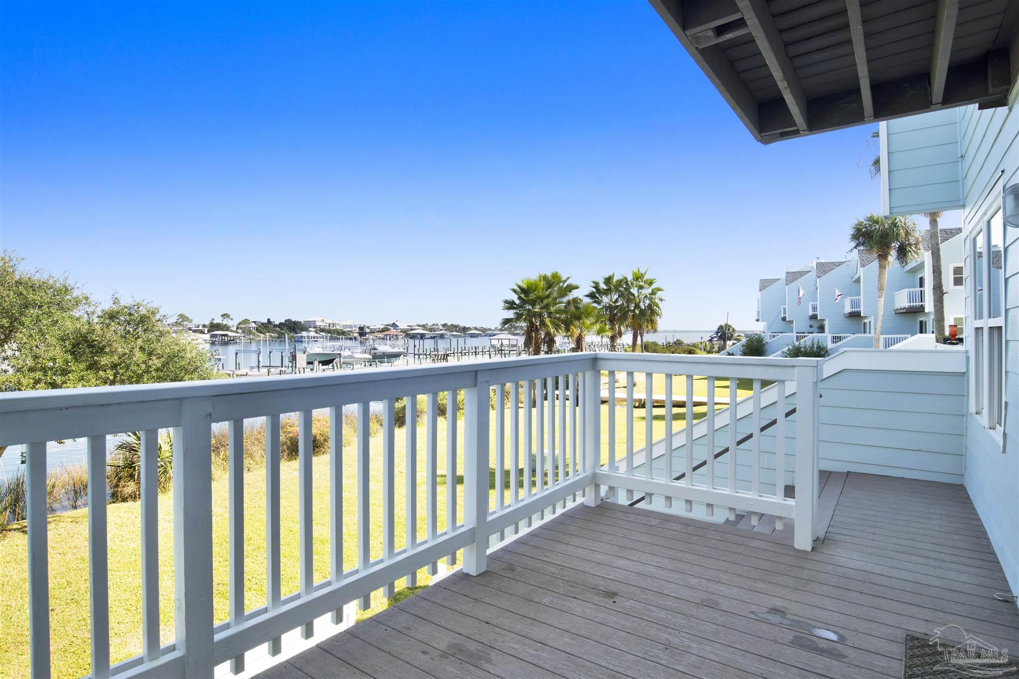 16784 Perdido Key Drive, Unit 9 Pensacola, FL 32507 - Photo 7 of 48 a view of a balcony with wooden floor